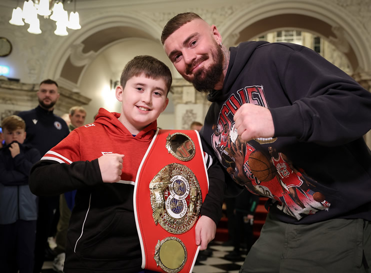 Young boxer Lewis Morrow from Cairn Lodge Boxing Club joins IBF World Welterweight Champion Lewis Crocker at a special civic reception in City Hall