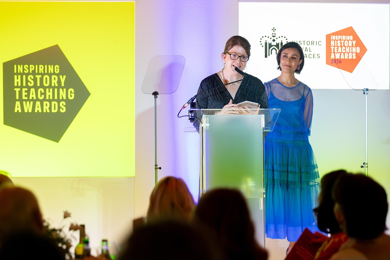 Broadcaster Anita Rani presents Elaine McPeake from St Dominic's Grammar School, Belfast, with her Northern Ireland winner's award at the Historic Royal Palaces Inspiring History Teaching Awards